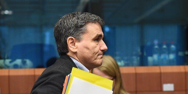 Greece's Finance Minister Euclid Tsakalotos arrives for an Eurogroup Finance Ministers' meeting at the European Council, in Brussels on November 9, 2015. AFP PHOTO/Emmanuel Dunand (Photo credit should read EMMANUEL DUNAND/AFP/Getty Images)