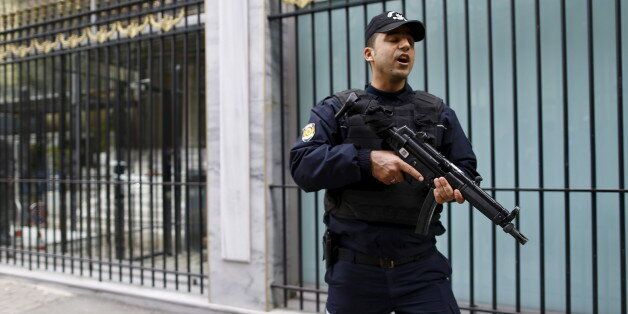 A Turkish riot police stands guard in front of the Belgian Consulate in central Istanbul, Turkey March 22, 2016. REUTERS/Osman Orsal