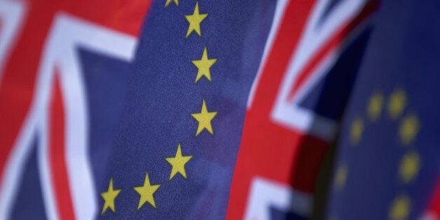 KNUTSFORD, UNITED KINGDOM - MARCH 17: In this photo illustration, the European Union and the Union flag sit together on bunting on March 17, 2016 in Knutsford, United Kingdom. The United Kingdom will hold a referendum on June 23, 2016 to decide whether or not to remain a member of the European Union (EU), an economic and political partnership involving 28 European countries which allows members to trade together in a single market and free movement across its borders for citizens. (Photo by il