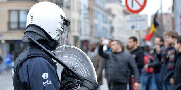 BRUSSELS, BELGIUM - APRIL 2 : Riot police secure a zone in the Molenbeek neighborhood in Brussels, Belgium, on April 2, 2016. Belgian police and soldiers have fanned out across Brussels, making arrests to stop protesters from the far-left and far-right who are trying to break a ban on demonstrations. (Photo by Dursun Aydemir/Anadolu Agency/Getty Images)