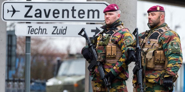 Belgian Army soldiers patrol at Zaventem Airport in Brussels on Wednesday, March 23, 2016. Belgian authorities were searching Wednesday for a top suspect in the country's deadliest attacks in decades, as the European Union's capital awoke under guard and with limited public transport after 34 were killed in bombings on the Brussels airport and a subway station. (AP Photo/Geert Vanden Wijngaert)