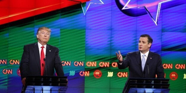 Republican presidential candidate, Sen. Ted Cruz, R-Texas, speaks, as Republican presidential candidate, businessman Donald Trump listens, during the Republican presidential debate sponsored by CNN, Salem Media Group and the Washington Times at the University of Miami, Thursday, March 10, 2016, in Coral Gables, Fla. (AP Photo/Wilfredo Lee)