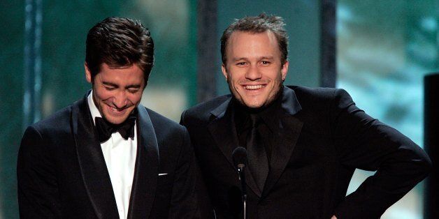 LOS ANGELES, CA - JANUARY 29: Actor Jake Gyllenhaal and Heath Ledger speak onstage during the 12th Annual Screen Actors Guild Awards held at the Shrine Auditorium on January 29, 2006 in Los Angeles, California. (Photo by Kevin Winter/Getty Images)