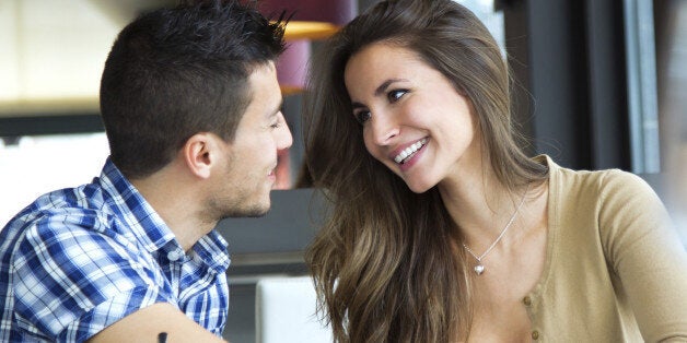 Portrait of young couple in love at a coffee shop