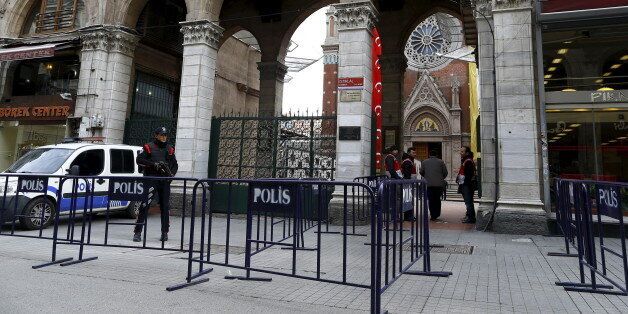 A Turkish police officer stands guard in front of St Antouan Church at Istiklal Street in Istanbul, Turkey March 27, 2016. REUTERS/Osman Orsal