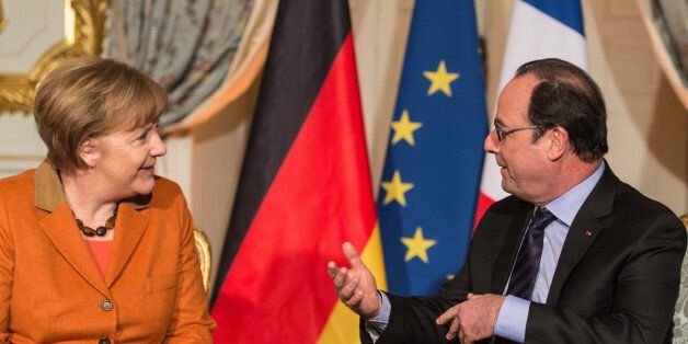 French president Francois Hollande, right, speaks to German Chancellor Angela Merkel during their meeting in Strasbourg, eastern France, Sunday, Feb.7, 2016. (Patrick Seeger/Pool Photo via AP)