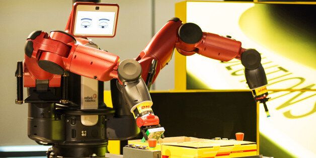 A Baxter robot, manufactured by Rethink Robotics Inc, operates during a demonstration at the launch of the Asia Pacific Innovation Center (APIC) operated by DHL, a unit of Deutsche Post AG, in Singapore, on Wednesday, Dec. 9, 2015. The APIC, DHL's first innovation center outside of Germany, showcases the latest in disruptive logistics and supply chain solutions. Photographer: Nicky Loh/Bloomberg via Getty Images