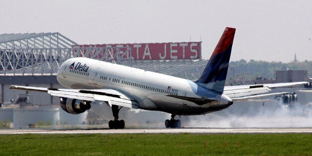 A Delta Airlines jet lands at Hartsfield-Jackson Atlanta International Airport following the announcement of a merger between Delta and Northwest Airlines in Atlanta, Georgia, April 15, 2008. REUTERS/Tami Chappell (UNITED STATES)