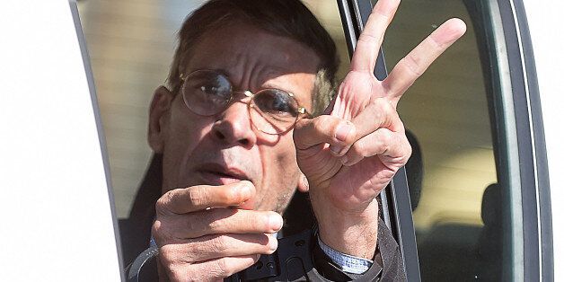 Handcuffed Seif al-Din Mohamed Mostafa, an Egyptian man who hijacked an EgyptAir passenger plane the previous day and forced it to divert to Cyprus demanding to see his ex-wife, flashes the 'V' for victory sign as he leaves the court in Larnaca in a police car on March 30, 2016.Mostafa was remanded into police custody for eight days during his first court appearance. Police told the court that 58-year-old Egyptian national faces possible charges of hijacking, kidnapping people with the aim of ta