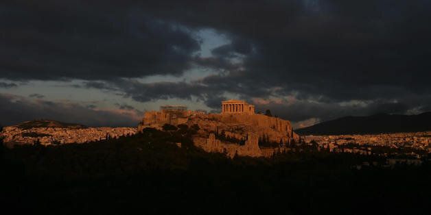 Athens, GREECE: The ancient Acropolis in Athens is pictured during a cloudy winter sunset 04 January 2007. Greece has enjoyed unusually mild weather this past month. AFP PHOTO / Aris Messinis (Photo credit should read ARIS MESSINIS/AFP/Getty Images)