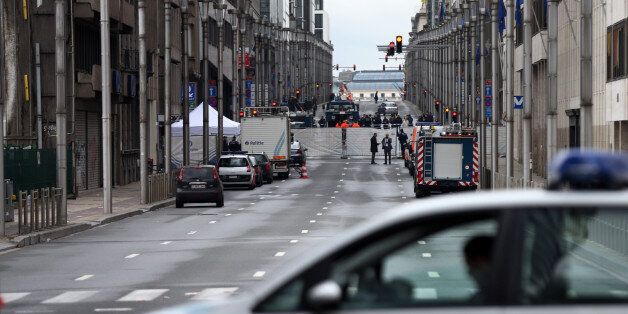 BRUSSELS, BELGIUM - MARCH 23: A police car blocks a road near Maelbeek metro station following yesterday's attack, on March 23, 2016 in Brussels, Belgium. Belgium is observing three days of national mourning after 34 people were killed in a twin suicide blast at Zaventem Airport and a further bomb attack at Maelbeek Metro Station. Two brothers are thought to have carried out the airport attack and an international manhunt is underway for a third suspect. The attacks come just days after a key suspect in the Paris attacks, Salah Abdeslam, was captured in Brussels. (Photo by Carl Court/Getty Images)