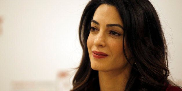 British lawyer Amal Clooney attends a press conference with former Maldives president Mohamed Nasheed in London, Monday, Jan. 25, 2016. President Nasheed is the first democratically-elected leader of his country and a renowned champion for human rights and climate justice. In March 2015, he was sentenced to 13 years' imprisonment in the Maldives by the authoritarian regime of Abdulla Yameen, the half-brother of a former dictator. (AP Photo/Alastair Grant)