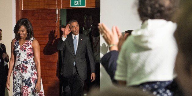 US President Barack Obama and First Lady Michelle Obama arrive to meet with staff at the US embassy in Havana on March 20, 2016. Obama arrived in Cuba to bury the hatchet in a more than half-century-long Cold War conflict that turned the communist island and its giant neighbor into bitter enemies. AFP PHOTO/Nicholas KAMM / AFP / NICHOLAS KAMM (Photo credit should read NICHOLAS KAMM/AFP/Getty Images)
