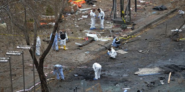 Police forensic officials work at the Sunday's explosion site in Ankara, Turkey, Monday, March 14, 2016. A senior government official told The Associated Press that authorities believe the attack was carried out by two bombers, one of them a woman, and was the work of Kurdish militants. It was the second deadly attack blamed on Kurdish militants in the capital in the past month. (AP Photo)