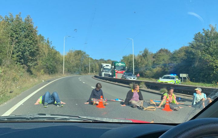 Extinction Rebellion activists glued to the A20 near Dover