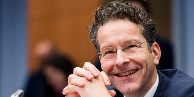 Dutch Finance Minister and chair of the eurogroup finance ministers Jeroen Dijsselbloem smiles as he arrives for an Eurogroup finance ministers meeting at the EU Council building in Brussels on Monday, Dec. 7, 2015. (AP Photo/Geert Vanden Wijngaert)