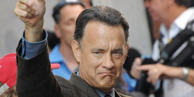 US actor Tom Hanks gestures as he takes part in the shooting of the movie 'Angels and Demons' on June 9, 2008 at Piazza del Pantheon, in Rome. The film directed by Ron Howard is inspired by Dan Brown's best seller. AFP PHOTO/ TIZIANA FABI (Photo credit should read TIZIANA FABI/AFP/Getty Images)