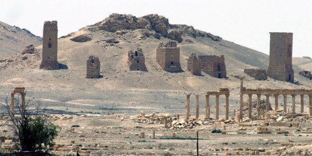 FILE - This file photo released on Sunday, May 17, 2015, by the Syrian official news agency SANA, shows the general view of the ancient Roman city of Palmyra, northeast of Damascus, Syria. Islamic State militants beheaded 81-year-old Khaled al-Asaad, a leading Syrian antiquities scholar who spent most of his life looking after the ancient ruins of Palmyra, then hung his body from a pole in a main square of the historic town, Syrian activists and the scholar's relatives said Wednesday, Aug. 19, 2015. (SANA via AP, File)