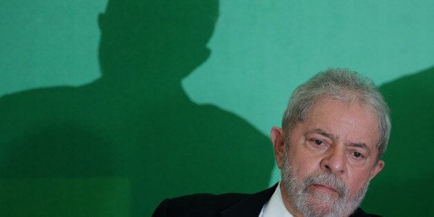 Brazil's former President Luiz Inacio Lula da Silva attends his swearing-in ceremony as the chief of staff, at the Planalto presidential palace, in Brasilia, Brazil, Thursday, March 17, 2016. Silva was sworn in as his successorâs chief of staff on Thursday. President Dilma Rousseff insisted Silva would help put the troubled country back on track and denounced attempts to oust her. (AP Photo/Eraldo Peres)