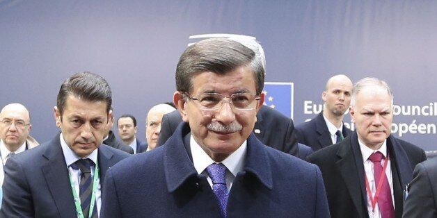BRUSSELS, BELGUM - MARCH 18: Prime Minister of Turkey Ahmet Davutoglu delivers a speech during a press briefing as he attends the EU leaders summit at Headquarters of European Council in Brussels, Belgium on March 18, 2016. (Photo by Halil Sagirkaya/Anadolu Agency/Getty Images)