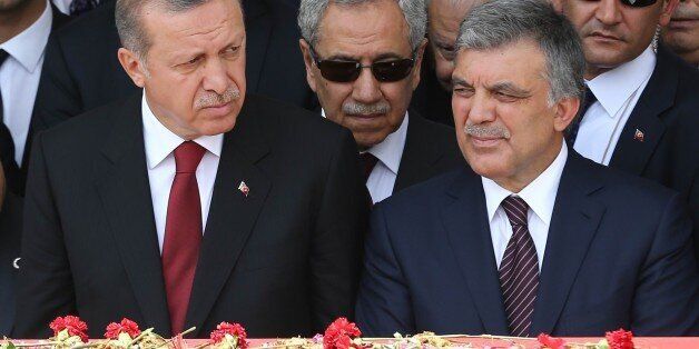 Turkey's President Recep Tayyip Erdogan (L) and Turkey's former President Abdullah Gul (R) attend the state funeral of Turkey's ninth President and former Prime Minister, Suleyman Demirel, at the Grand National Assembly of Turkey (TBMM) in Ankara, Turkey on June 19, 2015.. Turkey's former president and prime minister Suleyman Demirel, a giant figure in the country's politics for over half a century, died on June 17, 2015. In a remarkable career, Demirel survived his dismissal in two military coups and a ban on holding office to become president and one of Turkey's most respected elder statesmen. AFP PHOTO / ADEM ALTAN (Photo credit should read ADEM ALTAN/AFP/Getty Images)