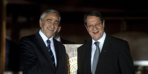 Cypriot President Nicos Anastasiades (R) shakes the hand of Turkish Cypriot President of the self-proclaimed Turkish Republic of Northern Cyprus (TRNC), Mustafa Akinci, following a UN-sponsored meeting at Ledra palace on May 11, 2015. AFP PHOTO / IAKOVOS HATZISTAVROU (Photo credit should read IAKOVOS HATZISTAVROU/AFP/Getty Images)