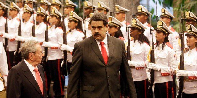 HAVANA, CUBA - MARCH 18: Cuban President Raul Castro (L) and President Nicolas Maduro of Venzuela walk past the Guard of Honor at the Cuban State Council during an official welcome ceremony on March 18, 2016 in Havana, Cuba. Maduro was awarded the Jose Marti medal, Cubas highest honor named after the Cuban revolutionary Marti. (Photo by Sven Creutzmann/Mambo photo/Getty Images)