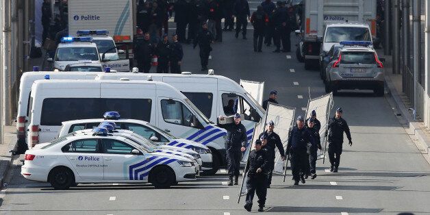 BRUSSELS, BELGIUM - MARCH 22: Soldiers, police officers and medical personnel attend the scene at the Maelbeek metro station following todays attack on March 22, 2016 in Brussels, Belgium. At least 34 people are thought to have been killed after Brussels airport and the Metro station were targeted by explosions. The attacks come just days after a key suspect in the Paris attacks, Salah Abdeslam, was captured in Brussels. (Photo by Carl Court/Getty Images)