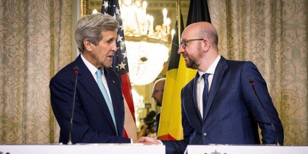 US Secretary of State John Kerry (L) shakes hands with Belgian Prime Minister Charles Michel during a meeting in Brussels on March 25, 2016. US Secretary of State John Kerry declared 'Je suis Bruxellois' -- 'I am a citizen of Brussels' -- in support for the people of the Belgian capital, echoing their backing for the United States after the 9/11 terror attacks.'Then, voices across Europe declared, 'Je suis Americain.' Now, we declare, 'Je suis Bruxellois' and 'Ik ben Brussel,' Kerry said in F