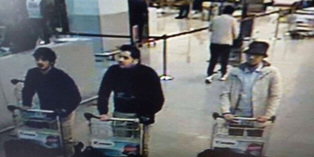 In this image provided by the Belgian Federal Police in Brussels on Tuesday, March 22, 2016 of three men who are suspected of taking part in the attacks at Belgium's Zaventem Airport. The man at right is still being sought by the police and two others in the photo that the police issued were according to a the Belgian Prosecutors 'probably' suicide bombers. Bombs exploded at the Brussels airport and one of the city's metro stations Tuesday, killing and wounding scores of people, as a European capital was again locked down amid heightened security threats. (Belgian Federal Police via AP)