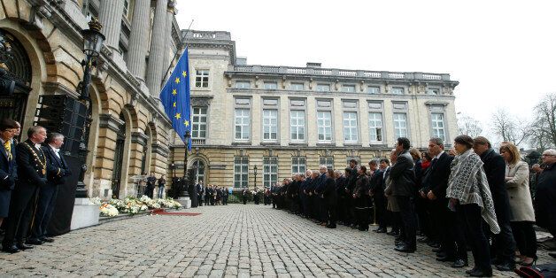 Belgium's King Philippe, and Queen Mathilde with Prime Minister Charles Michel and members of the government at lawmakers stand during a moment of silence in memory of the victims of the recent attacks in Belgium, on grounds of the Parliament building Brussels, Thursday, March, 24, 2016. Belgium's prime minister is promising to do everything to determine who was responsible for deadly attacks targeting the Brussels airport and subway system. Charles Michel, in a national mourning speech Thursday, said Tuesday's attacks on the European Union's capital targeted the