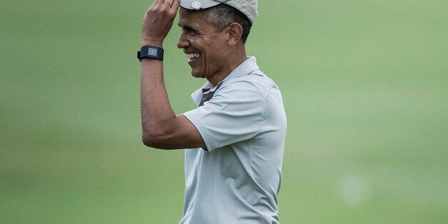 US President Barack Obama arrives on the 18th hole of the Mid-Pacific Country Club's golf course December 21, 2015 in Kailua, Hawaii. Obama and the First Family are in Hawaii for vacation. AFP PHOTO/BRENDAN SMIALOWSKI / AFP / BRENDAN SMIALOWSKI (Photo credit should read BRENDAN SMIALOWSKI/AFP/Getty Images)