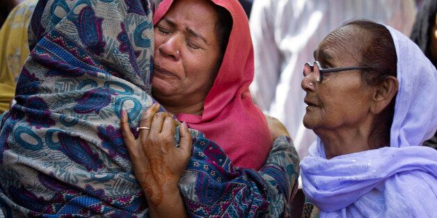 Women mourn the death of their family member who was killed in a suicide bombing, in Lahore, Pakistan, Monday, March 28, 2016. The death toll from a massive suicide bombing targeting Christians gathered on Easter in the eastern Pakistani city of Lahore rose on Monday as the country started observing a three-day mourning period following the attack. (AP Photo/B.K. Bangash)