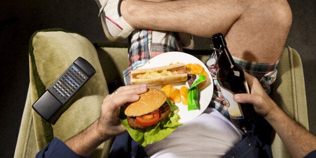 A man eats junk food