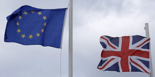 The British Union Flag, right, and the flag of the European Union (EU) fly from flagpoles outside a hotel in Gibraltar, U.K., on Sunday, March 6, 2016. Gibraltar is a the 300-year-old low-tax British territory on the southern tip of Spain. Photographer: Luke MacGregor/Bloomberg via Getty Images