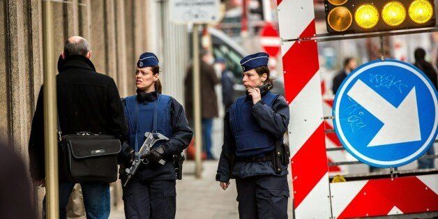 Belgian police officers patrol near Maalbeek metro station in Brussels on March 22, 2016 after a series of apparently coordinated explosions ripped through Brussels airport and the metro train, killing at least 14 people in the airport and 20 people in the metro in the latest attacks to target Europe.Security was tightened across the jittery continent and transport links paralysed after the bombings that Belgian Prime Minister Charles Michel branded 'blind, violent and cowardly'. / AFP / PHILIPPE HUGUEN (Photo credit should read PHILIPPE HUGUEN/AFP/Getty Images)