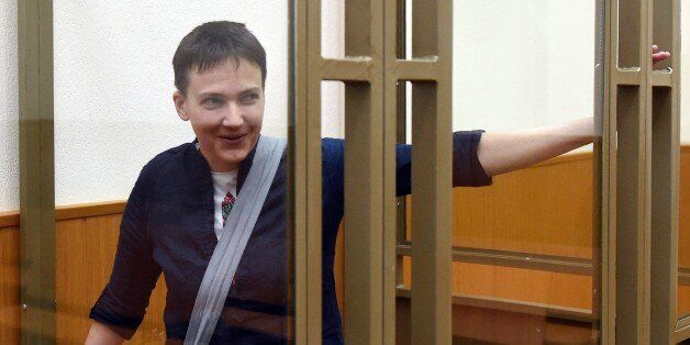Ukrainian military pilot Nadiya Savchenko looks out from a defendants' cage after the first day of the verdict announcement at a court in the southern Russian town of Donetsk, on March 21, 2016. A Russian court on March 21 began delivering its verdict in the high-profile murder trial of Ukrainian helicopter pilot Nadiya Savchenko, which Kiev and the West have slammed as a political sham. Prosecutors are demanding a 23-year jail term for Savchenko's alleged involvement in the killing of two Russian state TV journalists in war-torn eastern Ukraine in 2014. AFP PHOTO / VASILY MAXIMOV / AFP / VASILY MAXIMOV (Photo credit should read VASILY MAXIMOV/AFP/Getty Images)