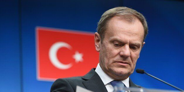 European Council President Donald Tusk addresses a press conference at the end of an EU leaders summit with Turkey centered on the the migrants crisis, at the European Council, in Brussels on March 8, 2016. European Union leaders will on March 7 back closing down the Balkans route used by most migrants to reach Europe, diplomats said, after at least 25 more people drowned trying to cross the Aegean Sea en route to Greece. The declaration drafted by EU ambassadors on March 6 will be announced at a summit in Brussels on March 7, set to also be attended by Turkish Prime Minister Ahmet Davutoglu. / AFP / EMMANUEL DUNAND (Photo credit should read EMMANUEL DUNAND/AFP/Getty Images)