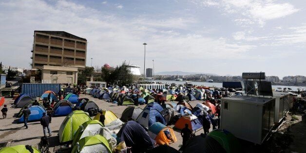 Tents are seen at the Athens' port of Piraeus, where over 5,000 refugees and migrants stay, on Tuesday, March 22, 2016. Greece detained hundreds of refugees and migrants on its islands Monday, as officials in Athens and the European Union conceded a much-heralded agreement to send thousands of asylum-seekers back to Turkey is facing delays. (AP Photo/Thanassis Stavrakis)