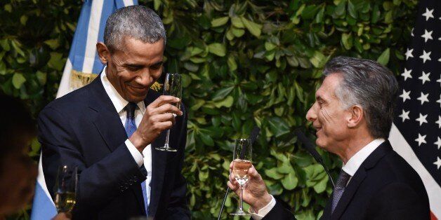 Argentina's President Mauricio Macri and US President Barack Obama toast each other during a state dinner at the Kirchner Cultural Centre in Buenos Aires on March 23, 2016. The United States and Argentina sealed a major trade deal on the eve -the first day of President Barack Obama's visit- bolstering the efforts of his counterpart to end a decade-and-a-half of international financial isolation. AFP PHOTO / NICHOLAS KAMM / AFP / NICHOLAS KAMM (Photo credit should read NICHOLAS KAMM/AFP/Getty Images)