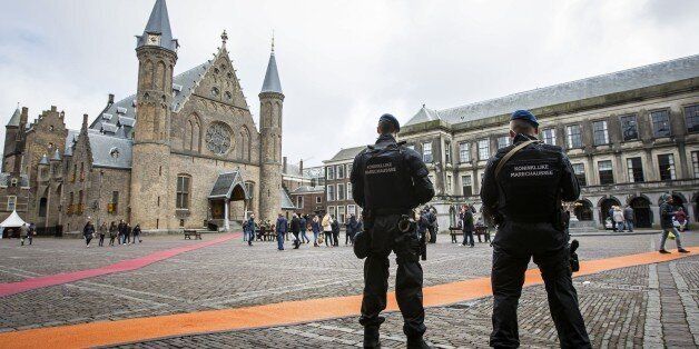 Dutch military police stand guard at the Binnenhof during a patrol in The Hague on March 23, 2016 as security measures were reinforced in the wake of attacks in Brussels.World leaders united in condemning the carnage in Brussels and vowed to combat terrorism, after Islamic State bombers killed around 31 people in a strike at the symbolic heart of the EU. / AFP / ANP / Bart Maat / Netherlands OUT (Photo credit should read BART MAAT/AFP/Getty Images)