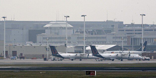 A photo taken on March 22, 2016 shows Brussels Airport, in Zaventem, after two explosions rocked the main hall of the airport.At least 13 people have been killed after two explosions occured in the departure hall of Brussels Airport. Government sources speak of a terrorist attack. The terrorist threat level has been heightened to four across the country. / AFP / BELGA / DIRK WAEM / Belgium OUT (Photo credit should read DIRK WAEM/AFP/Getty Images)