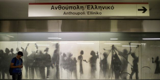 ATHENS, GREECE - JULY 07: Commuters use the Athens Metro which has been declared free to use during the current Euro crisis on July 7, 2015 in Athens, Greece. Greek Prime Minister Alexis Tsipras is working on new debt crisis proposals and is due to present them at a Eurozone emergency summit today. (Photo by Christopher Furlong/Getty Images)