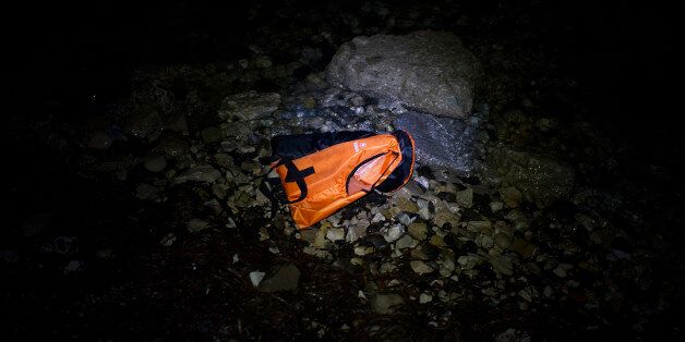 MYTELENE, GREECE - MARCH 09: A life vests floats in the water after an inflatable boat with refugees arrived, crossing the sea from Turkey to Lesbos, some 5 kilometres south of the capital of the Island, Mytelene on March 9, 2016 in Mytelene, Greece. During the night six inflatable baots reached the beaches of Lesbos. Joined Forces of the Standing NATO (North Atlantic Treaty Organisation) Maritime Group 2, including German Navy supply vessel 'Bonn' have arrived at the coast of the greek Island of Lesbos today in order to patrol between the coast of Turkey and Greece. Turkey has announced today to take back illegal migrants from Syria and to exchange those with legal migrants. (Photo by Alexander Koerner/Getty Images)