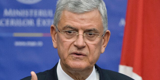 Turkey's European Affairs Minister Volkan Bozkir speaks during a joint press briefing with Romanian Foreign Minister Lazar Comanescu in Bucharest, Romania, Thursday, Feb. 11, 2016. Bozkir said that the joint Russian and Syrian regime forces strikes in the Aleppo area have pushed 50 thousand more refugees to the Turkish border and the numbers can increase sharply if a solutions to the Syrian crisis is not found. (AP Photo/Andreea Alexandru) ROMANIA OUT