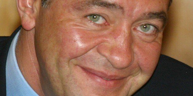 This photo taken on August 23, 2002 shows Russian Minister of Press, Television and Radio Broadcasting, Mikhail Lesin during his trip to Vladivostok with Russian president. Controversial Russian media mogul Mikhail Lesin, who helped found the RT English-language television network, has been found dead at a Washington hotel on November 6, 2015. He was 57. AFP PHOTO / ALEXANDER NEMENOV (Photo credit should read ALEXANDER NEMENOV/AFP/Getty Images)