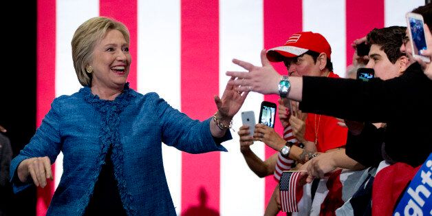 Democratic presidential candidate Hillary Clinton arrives to a cheering crowd at an election night event at the Palm Beach County Convention Center in West Palm Beach, Fla., Tuesday, March 15, 2016. (AP Photo/Carolyn Kaster)