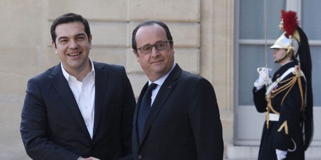 French President Francois Hollande (C) welcomes Greek Prime Minister Alexis Tsipras (L) at the Elysee Palace in Paris on March 12, 2016 before a meeting of European social democratic leaders on the future of the European Union. AFP PHOTO / DOMINIQUE FAGET / AFP / DOMINIQUE FAGET (Photo credit should read DOMINIQUE FAGET/AFP/Getty Images)
