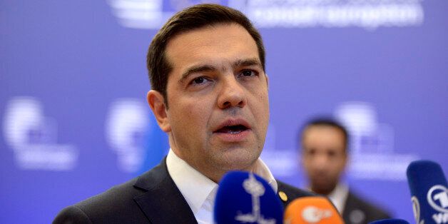Greek Prime Minister Alexis Tsipras talks to the media at the end of the European Summit in Brussels February 20, 2016.European leaders sealed a deal with the UK after hours of haggling at a marathon summit, paving the way for a referendum on whether Britain will stay in the EU. The European Union's two top figures, Donald Tusk and Jean-Claude Juncker, presented its 28 leaders with draft proposals at a long-delayed dinner after hours of painstaking face-to-face talks on an issue that threatened place in the union. / AFP / THIERRY CHARLIER (Photo credit should read THIERRY CHARLIER/AFP/Getty Images)