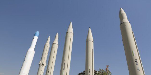 Missiles are displayed during an exhibition on the 1980-88 Iran-Iraq war, as part of the 'Sacred Defense Week' commemorating the 8-year war on September 28, 2014 at a park, northern Tehran. The war between Iran and Iraq was the longest conventional war of 20th century and was officially started on September 22, 1980, when Iraqi armed forces invaded western Iran and ended on August 20, 1988, when Iran accepted the United Nation's ceasefire resolution 598. AFP PHOTO/ATTA KENARE (Photo cre